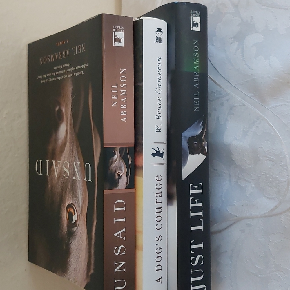 3 books featuring dogs. Excellent condition.